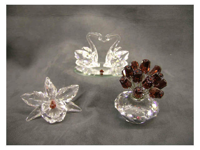 Appraisal: Swarovski Crystal Miniatures grouping three items pair of swans figure