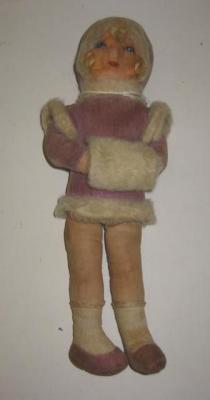 Appraisal: A Deans cloth doll with painted face wearing purple fur