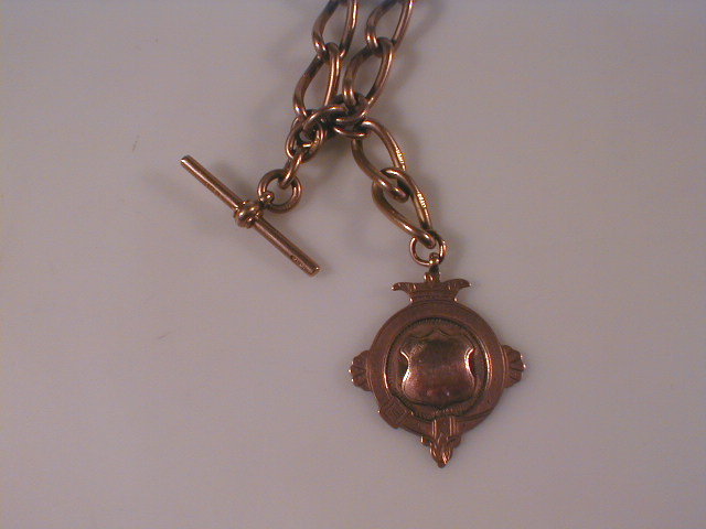 Appraisal: A large curb open link watch chain with attached fob