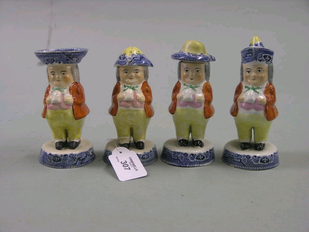 Appraisal: A set of four Victorian earthenware condiments each in the