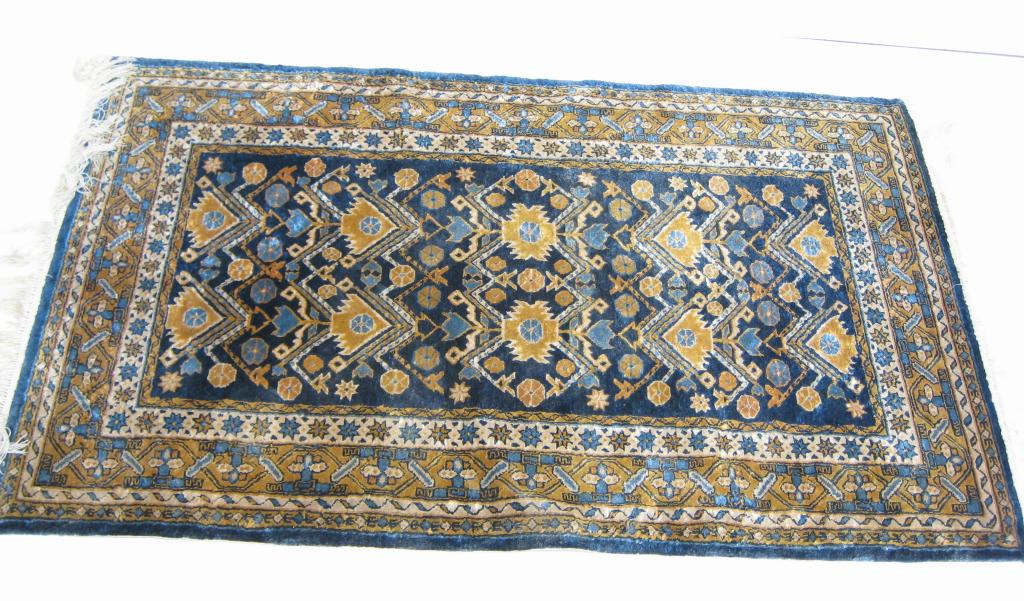 Appraisal: A Persian silk Rug with stylized tree motifs in gold