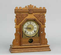 Appraisal: An Ingraham Co Pressed Wood Eight-Day Kitchen Clock An American