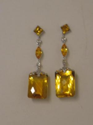 Appraisal: A PAIR OF CITRINE YELLOW SAPPHIRE AND DIAMOND EAR PENDANTS