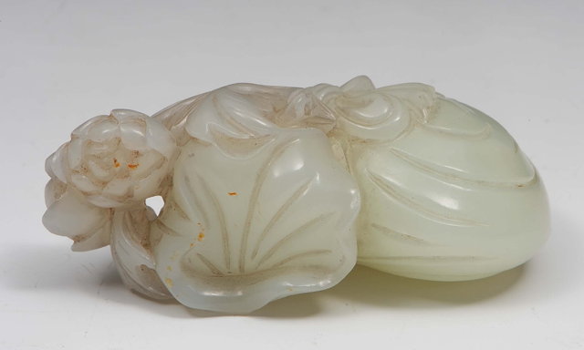 Appraisal: A Chinese white and russet jade group th th Centuryshowing