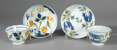 Appraisal: Two pearlware cups and saucers one with floral bouquets in