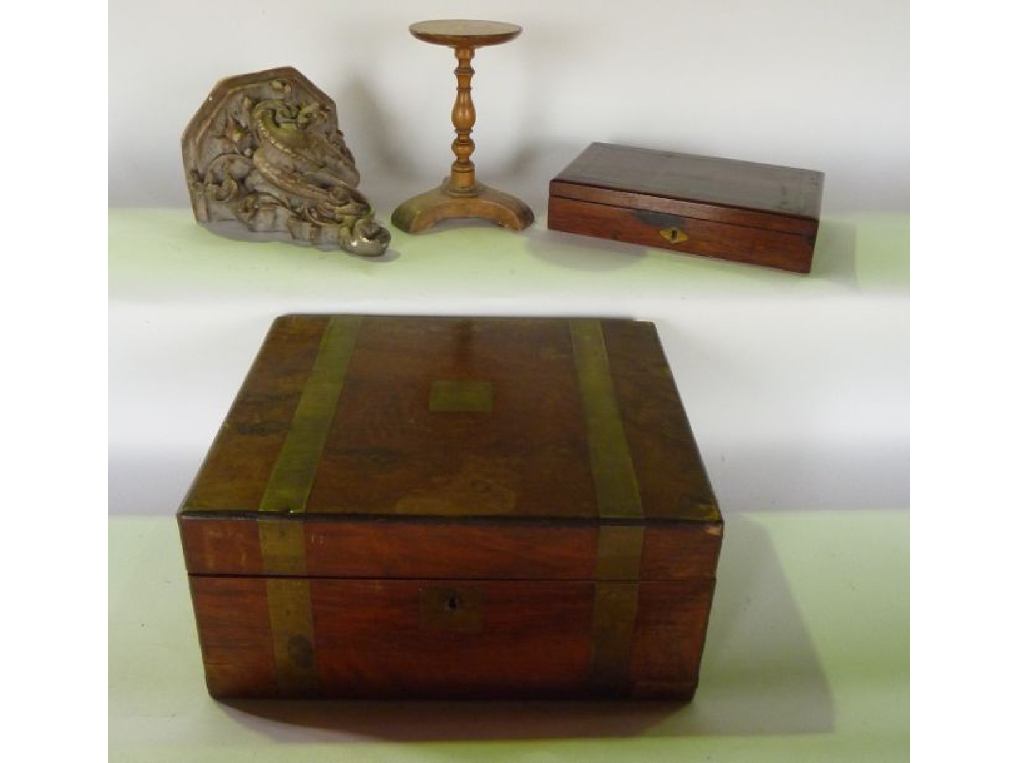 Appraisal: A th century mahogany veneered writing chest with banded brass