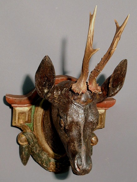 Appraisal: Black Forest carved roe deer head mounted on a polychrome