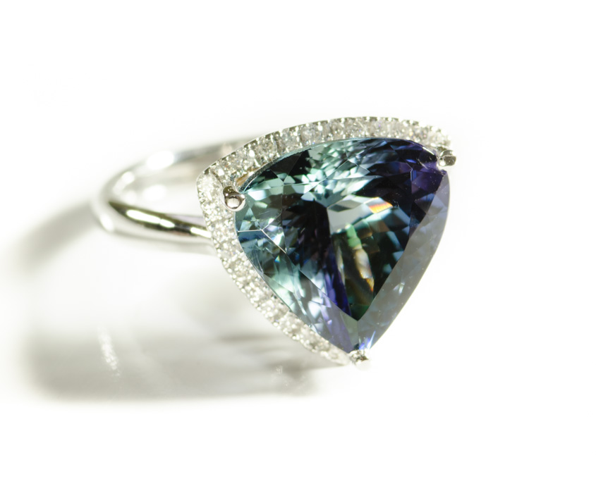 Appraisal: MULTI-COLOR TANZANITE AND DIAMOND RING k white gold with round-cut