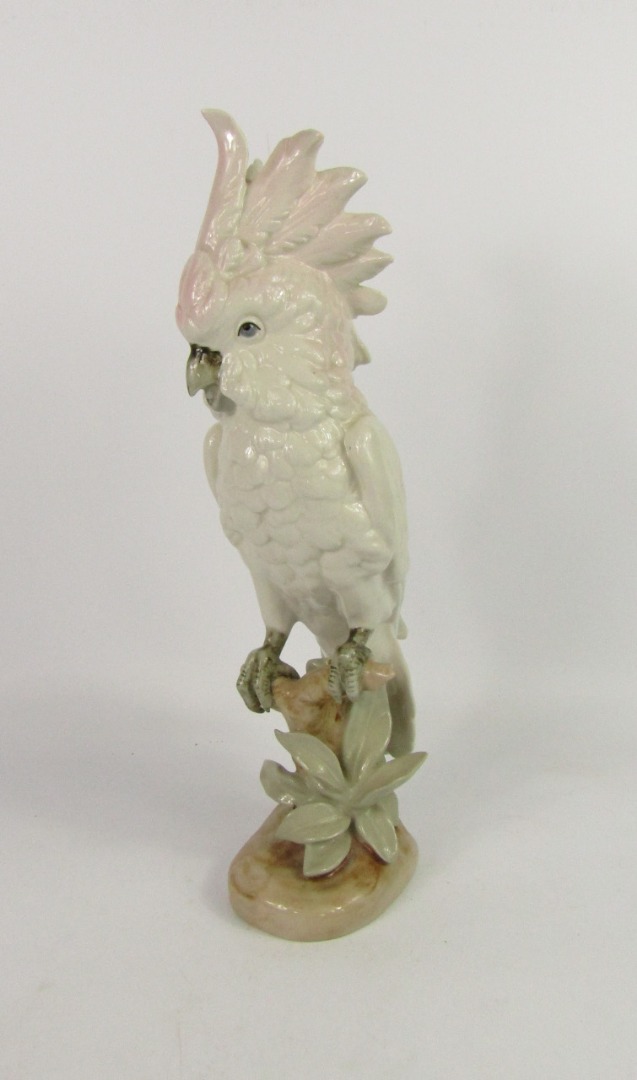 Appraisal: A Royal Dux porcelain figure of a cockatoo modelled perched