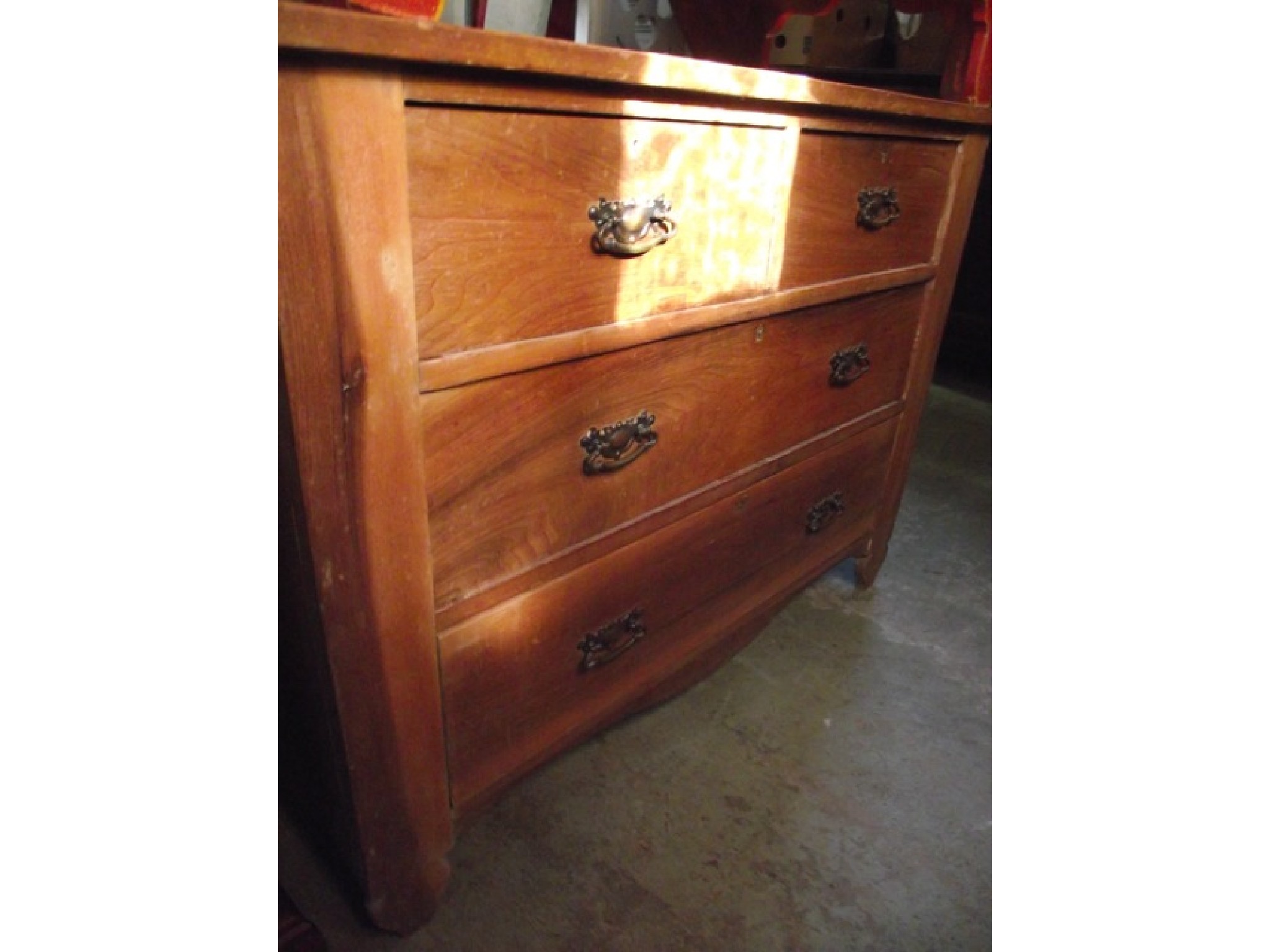 Appraisal: An Edwardian stained pine bedroom chest of two long and