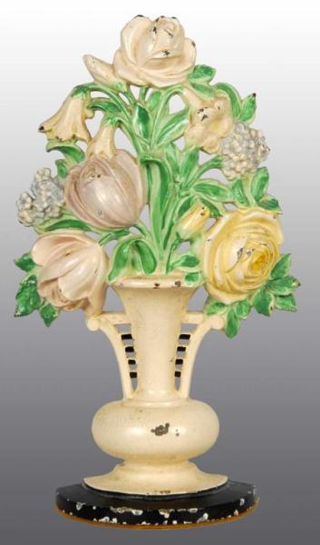 Appraisal: Cast Iron Tulips and Roses in Urn Doorstop Description Marked