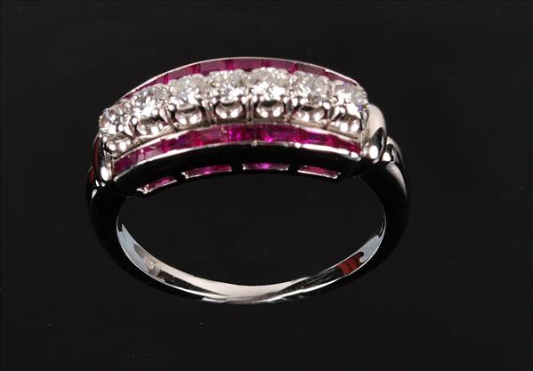 Appraisal: A ruby and diamond ring set with a line of