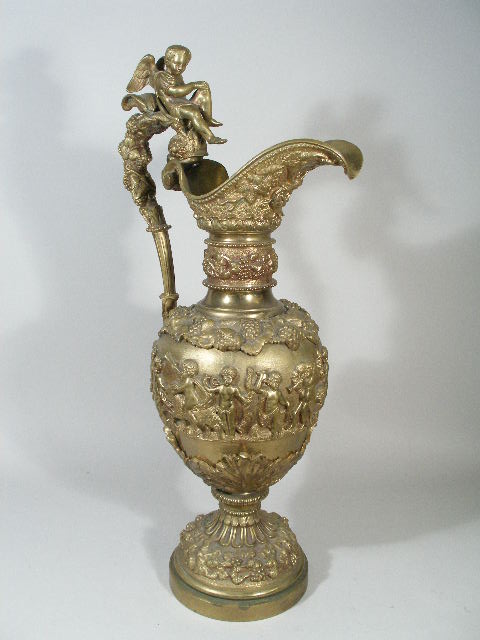 Appraisal: Brass Ewer th c ornately decorated in high relief w