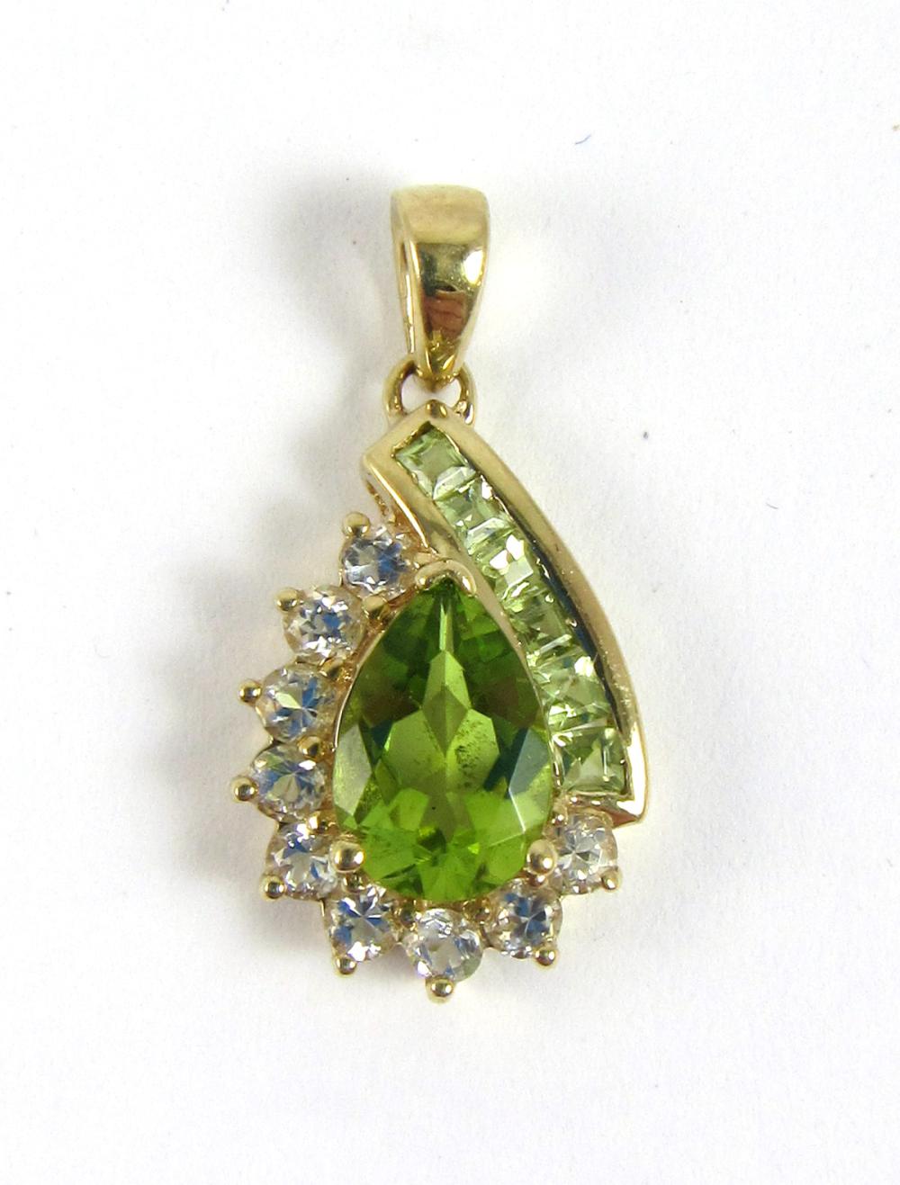 Appraisal: PERIDOT AND FOURTEEN KARAT GOLD PENDANT with six square table-cut