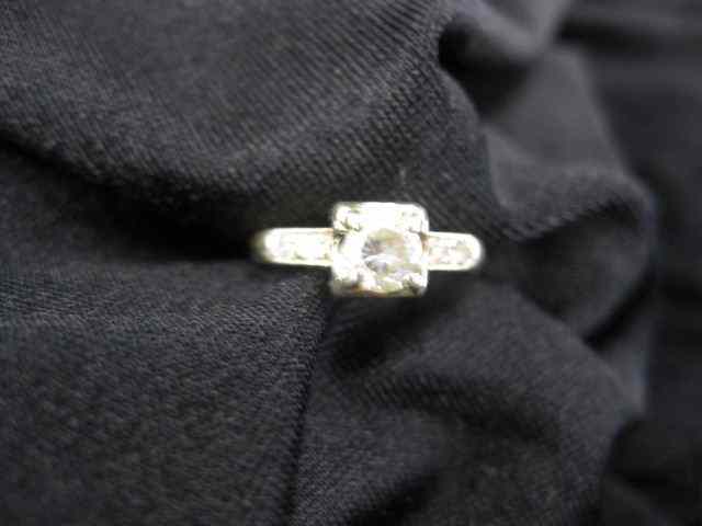 Appraisal: Diamond Ring carat round with twodiamonds on each side in