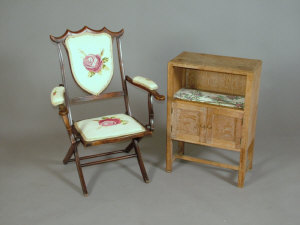 Appraisal: An Edwardian mahogany folding open armchair the shield shape back