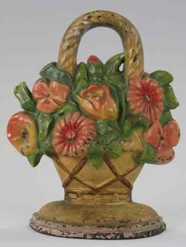 Appraisal: FLOWERS IN WOVEN BASKET DOORSTOP Signed ''LACS '' cast iron