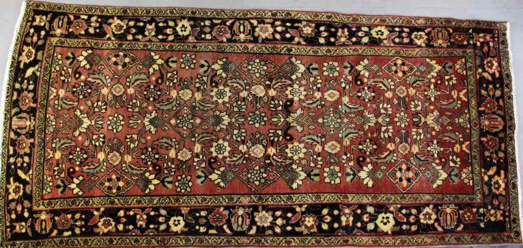 Appraisal: Oriental Wool RugHaving typical stylized floral and geometric decoration rose