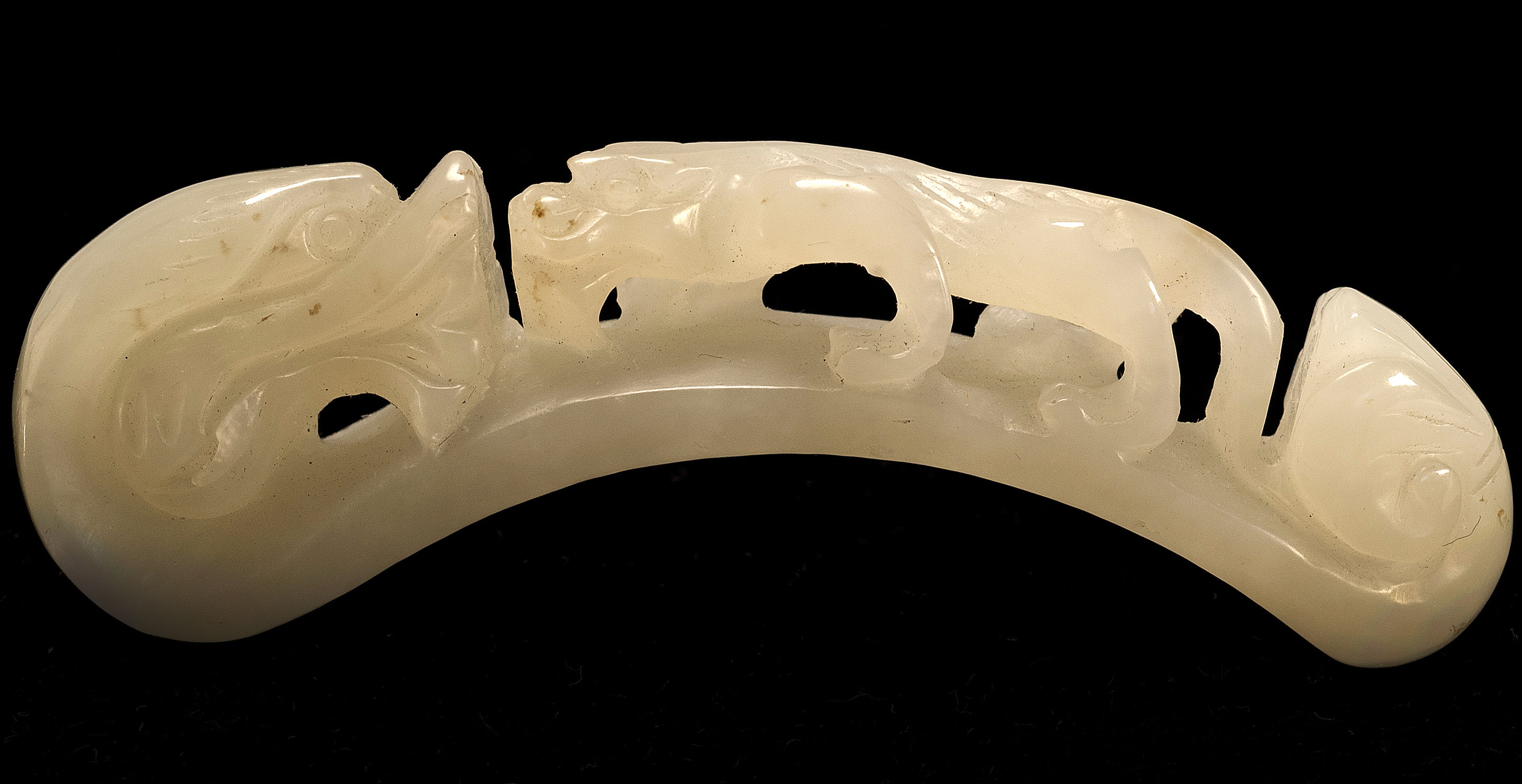 Appraisal: WHITE JADE LADY'S GIRDLE HOOK With relief qilong decoration Length