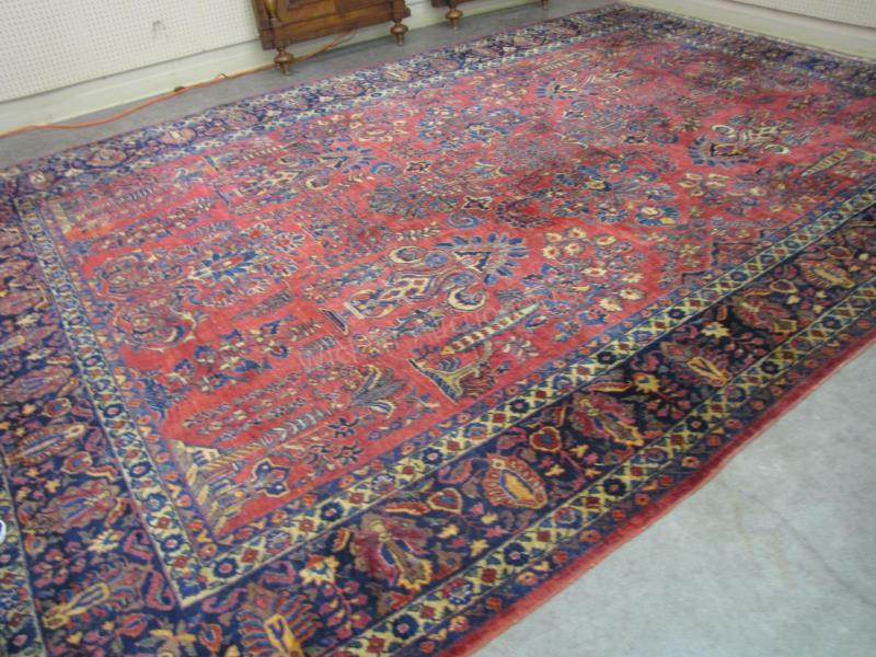 Appraisal: A semi-antique Oriental room size rug red field with traditional