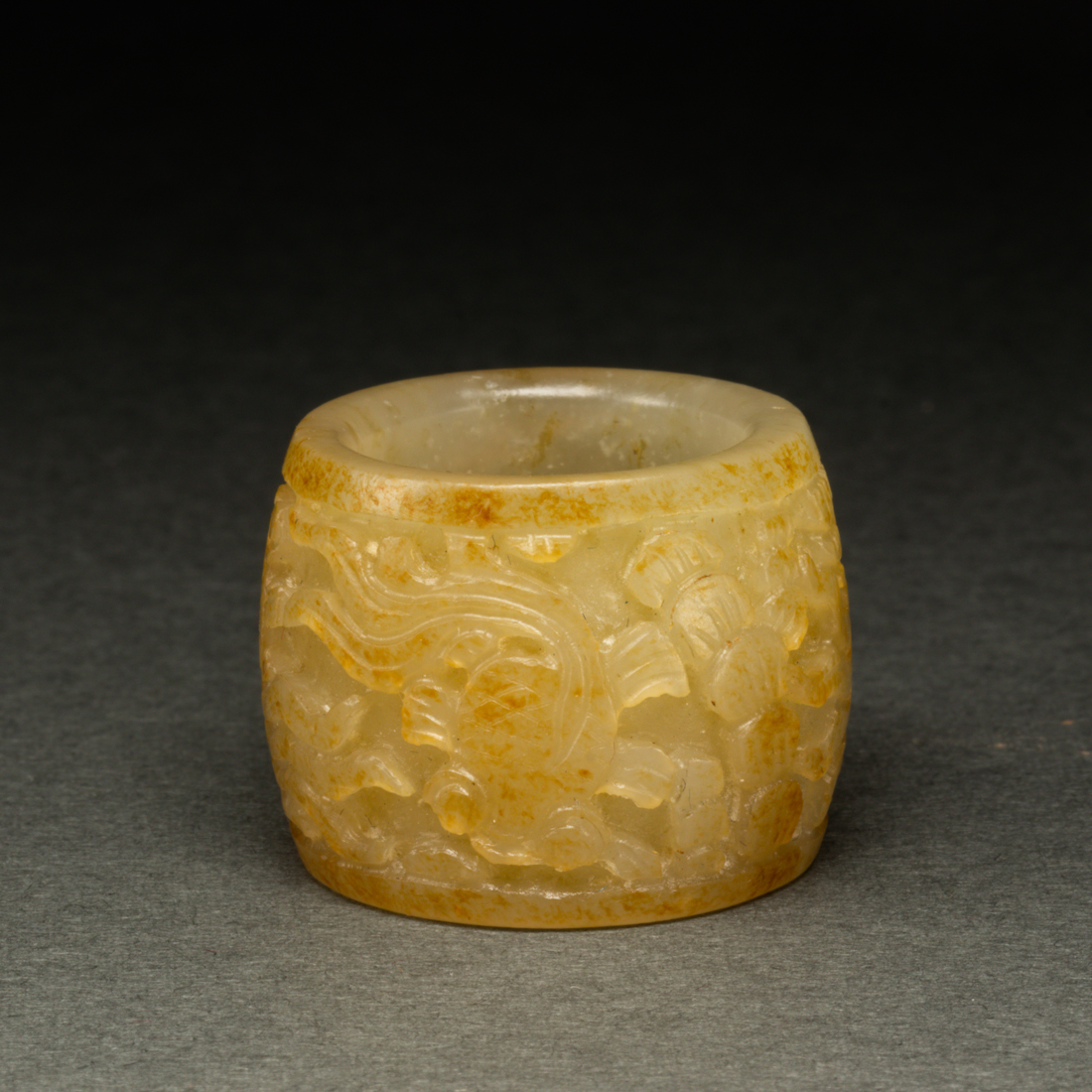 Appraisal: CHINESE WHITE AND RUSSET JADE ARCHER'S RING Chinese white and