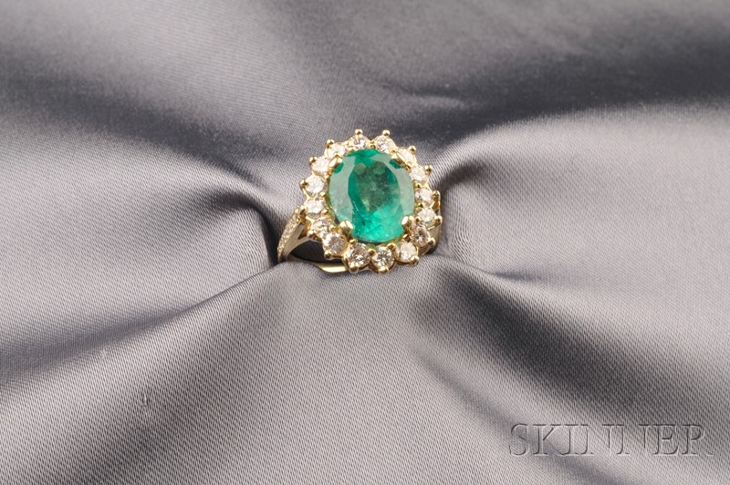 Appraisal: kt Gold Emerald and Diamond Ring prong-set with an oval-shape