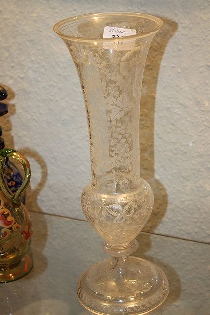 Appraisal: A VICTORIAN TALL GLASS VASE with white opaque flower decoration