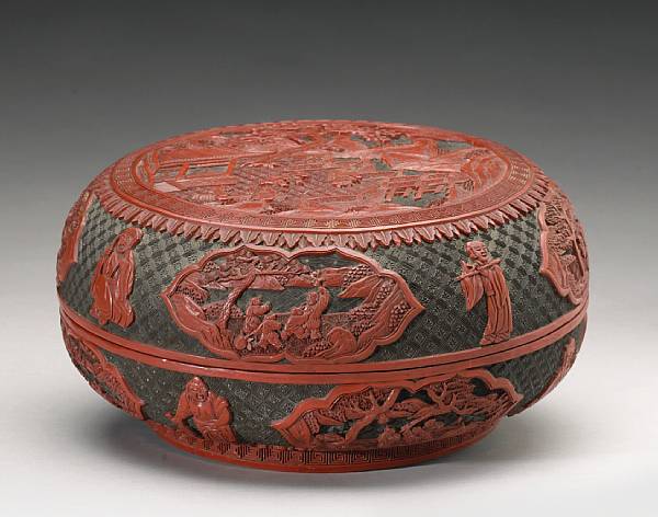 Appraisal: A cinnabar and black lacquer circular covered box The top