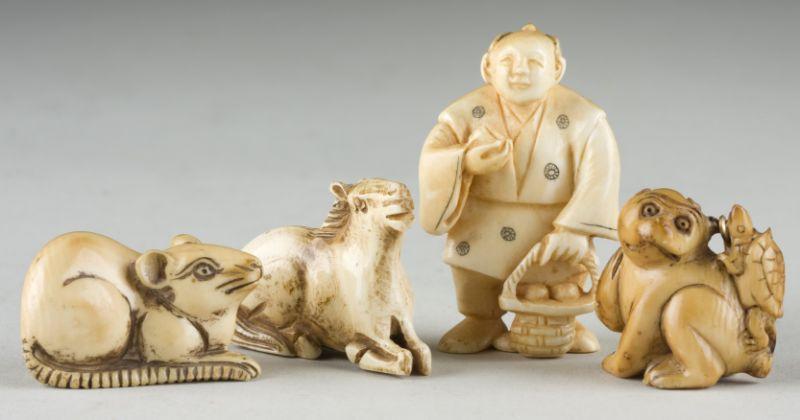 Appraisal: Carved Ivory Netsukes Japanese the first a male figure with