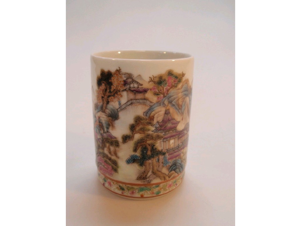 Appraisal: A Chinese brush pot painted with buildings and vegetation on