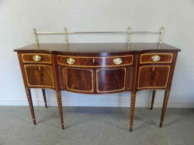 Appraisal: Mahogany Serpentine Front Inlaid Sideboard WithBrass Gallery Sheraton style and