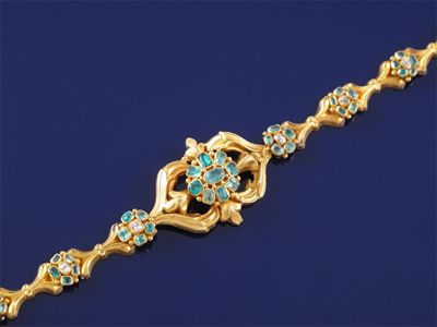 Appraisal: A Victorian bracelet The gold scroll design bracelet is mounted