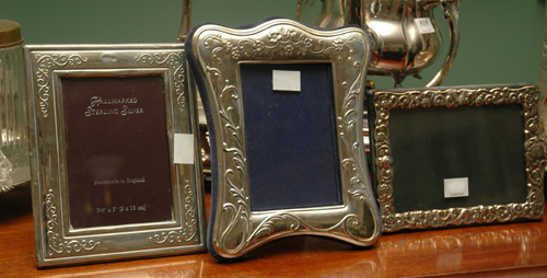 Appraisal: THREE STERLING SILVER PICTURE FRAMES