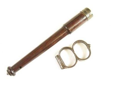 Appraisal: A George IV lignum vitae truncheon with a brass tip