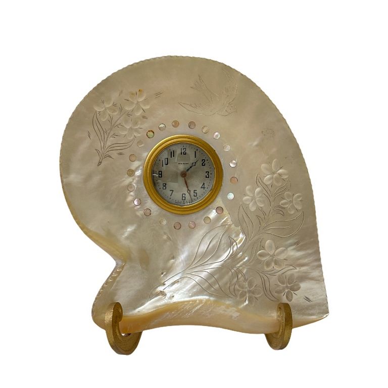 Appraisal: Mother of Pearl Shell Clock With metal stand It measures