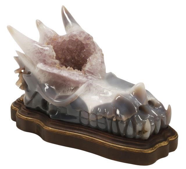 Appraisal: Carved amethyst agate dragon skull on wood base approx h