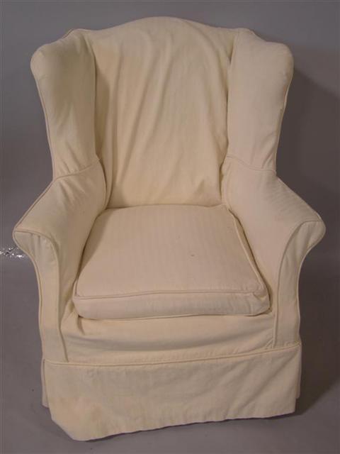 Appraisal: CHIPPENDALE STYLE WING CHAIR slipcovered in ivory twill having reeded