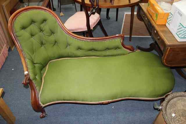 Appraisal: A VICTORIAN MAHOGANY FRAMED SHAPED BACK GREEN UPHOLSTERED CHAISE LONGUE