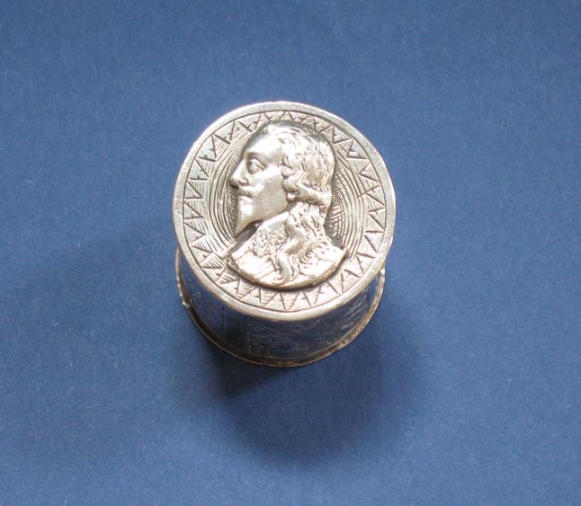 Appraisal: A COUNTER BOX of cylindrical form the pull-off cover decorated