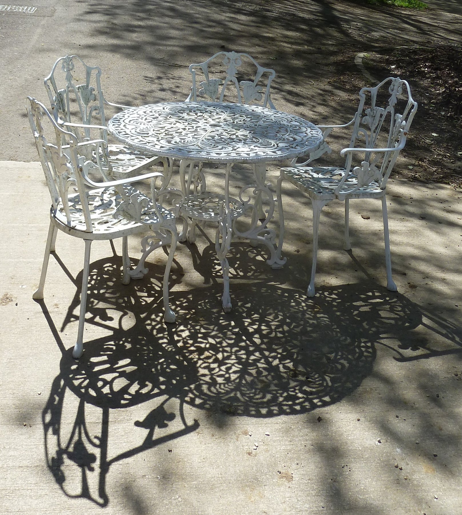 Appraisal: A white painted aluminium th Century style circular garden table