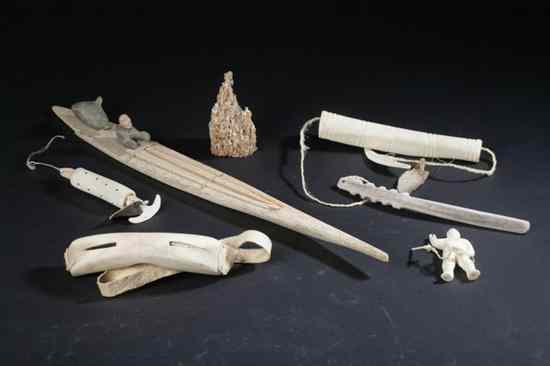 Appraisal: COLLECTION INUIT CARVED IVORY AND BONE OBJECTS Including sunglasses figure