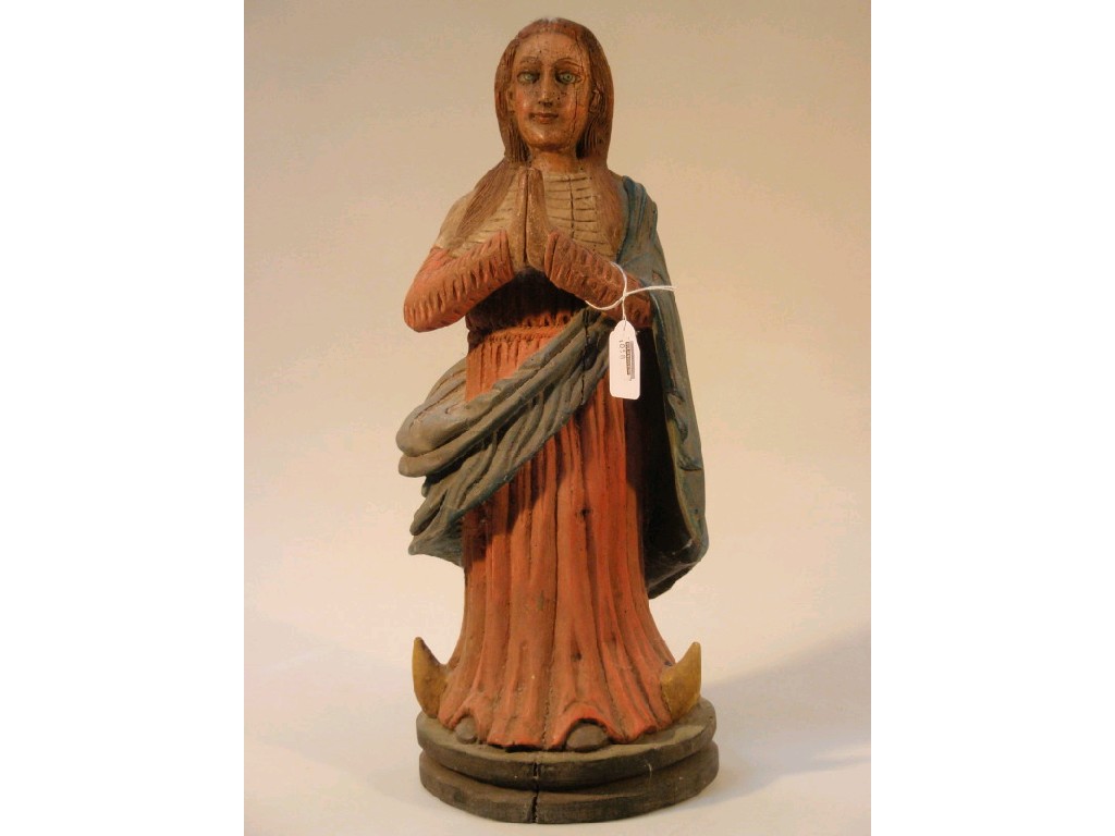 Appraisal: A polychrome painted carved wooden female cm high