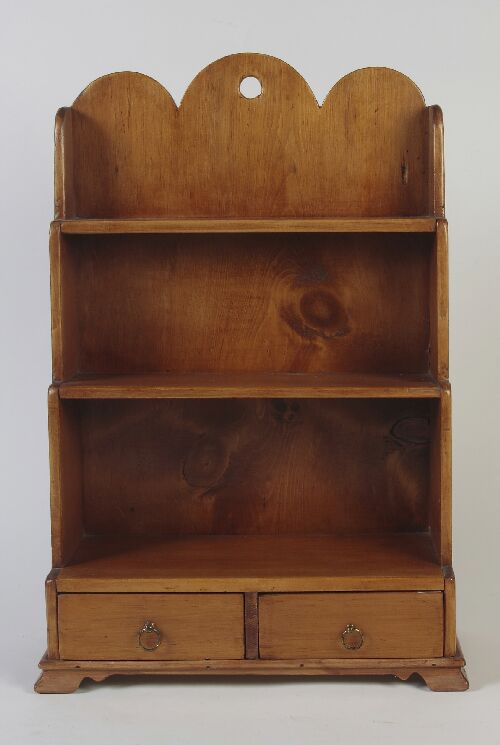 Appraisal: A miniature pine open bookcase the triple demi-lune top above