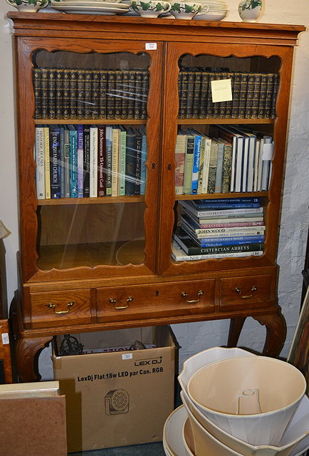 Appraisal: Georgian style display cabinetwith glazed doors containing three shelves over