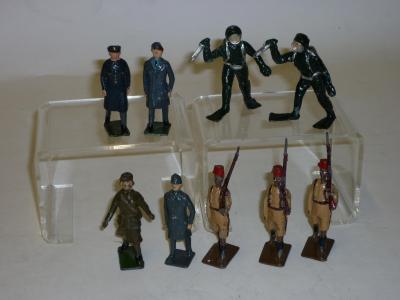 Appraisal: Nine metal figures comprising three Britains Sudanese riflemen two RAF