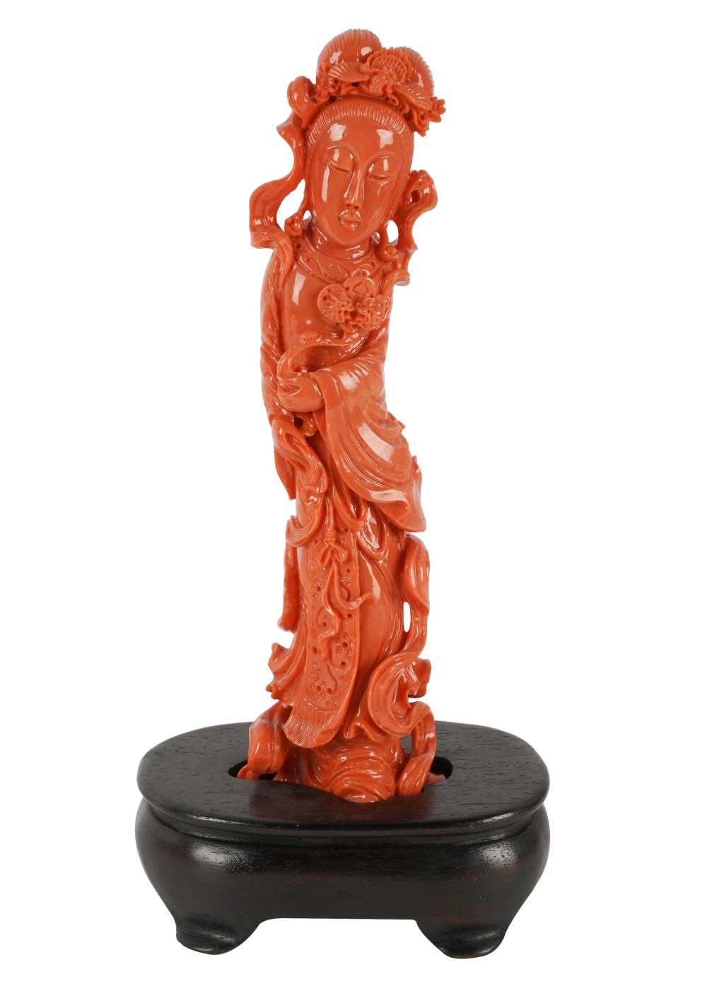 Appraisal: CHINESE CARVED CORAL QUAN YIN FIGUREwith a fitted wood base