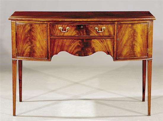 Appraisal: English mahogany bow front server th centuryshaped top over two