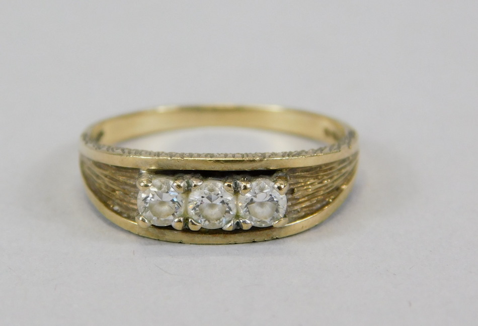 Appraisal: A ct gold dress ring set with three white stones