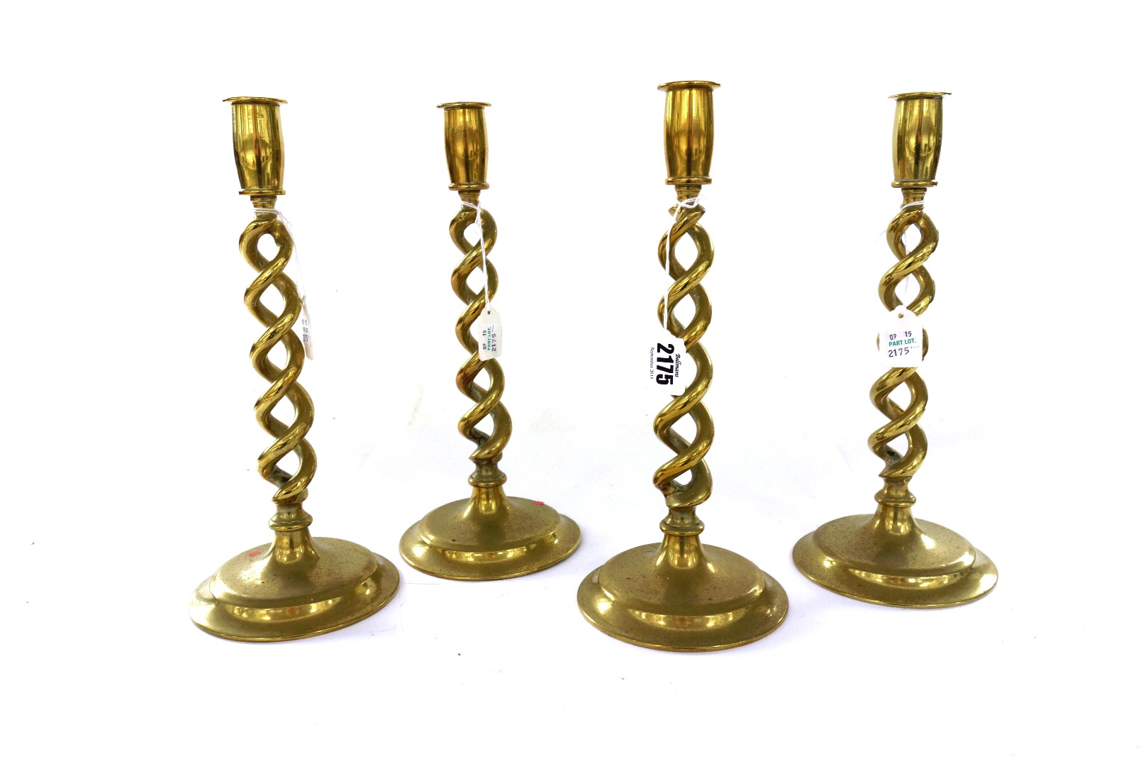 Appraisal: A set of four Victorian brass candlesticks each with an