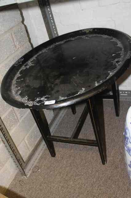 Appraisal: AN OVAL VICTORIAN BLACK PAPIER-MACHE TRAY on a stand